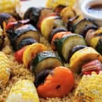 Vegan Harissa Grilled Veggie Kabobs with Corn Over Couscous