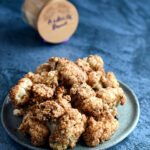 Air Fried Andouille Cauliflower on a blue ceramic plate